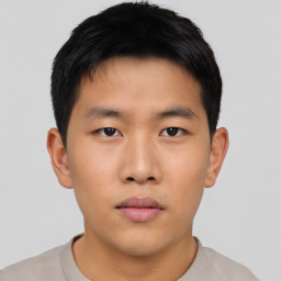 Neutral asian young-adult male with short  brown hair and brown eyes