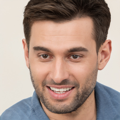 Joyful white young-adult male with short  brown hair and brown eyes