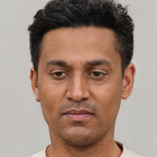 Neutral latino adult male with short  black hair and brown eyes