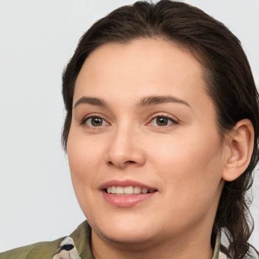 Joyful white young-adult female with medium  brown hair and brown eyes