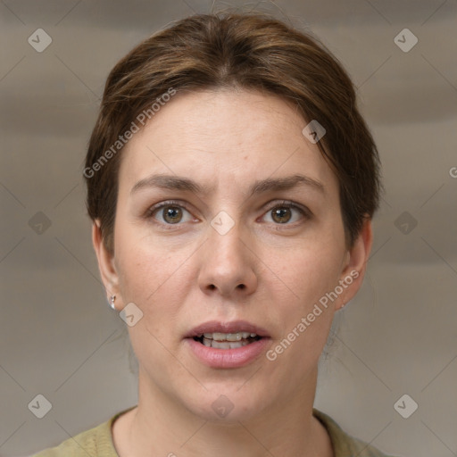 Joyful white young-adult female with medium  brown hair and grey eyes