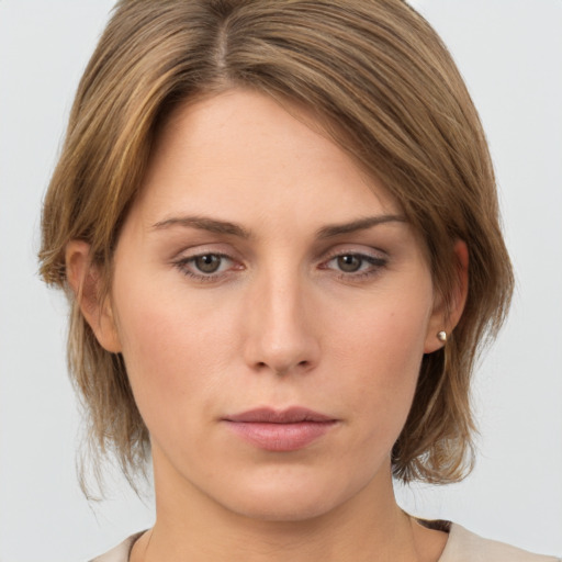 Neutral white young-adult female with medium  brown hair and grey eyes