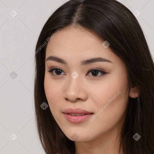 Joyful asian young-adult female with long  brown hair and brown eyes