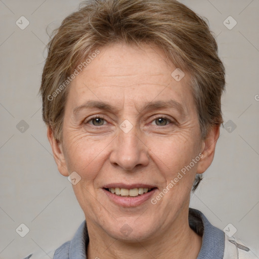 Joyful white middle-aged female with short  brown hair and grey eyes