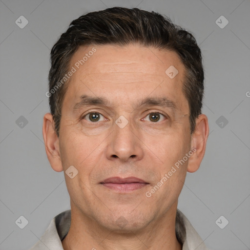 Joyful white adult male with short  brown hair and brown eyes