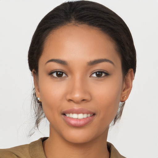 Joyful latino young-adult female with short  brown hair and brown eyes