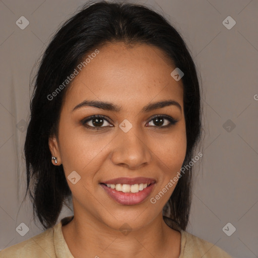 Joyful latino young-adult female with long  brown hair and brown eyes