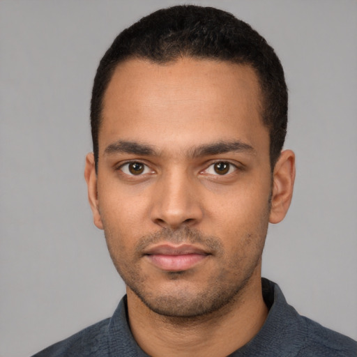 Neutral white young-adult male with short  black hair and brown eyes