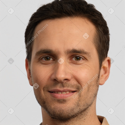 Joyful white young-adult male with short  brown hair and brown eyes