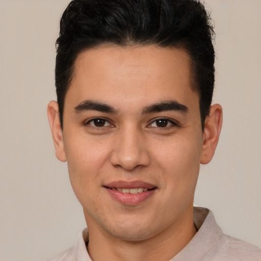 Joyful latino young-adult male with short  brown hair and brown eyes