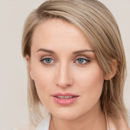 Joyful white young-adult female with long  brown hair and blue eyes