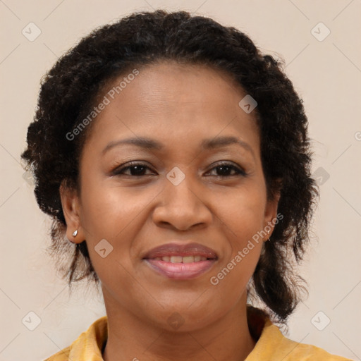 Joyful black adult female with medium  brown hair and brown eyes