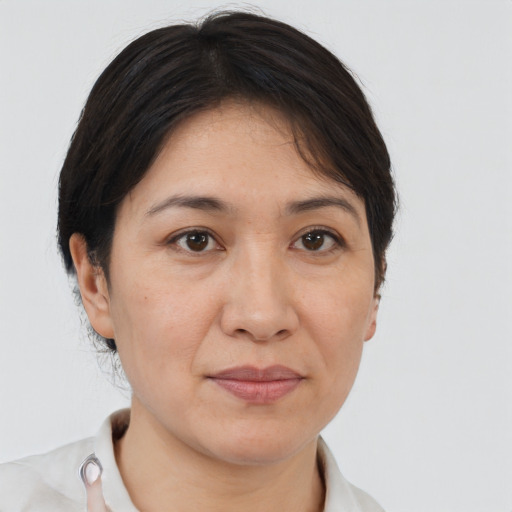 Joyful white adult female with short  brown hair and brown eyes