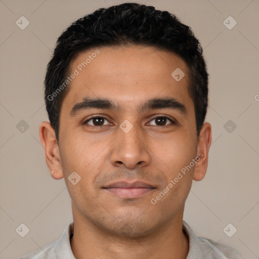 Joyful latino young-adult male with short  black hair and brown eyes