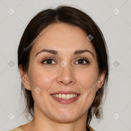 Joyful white adult female with medium  brown hair and brown eyes