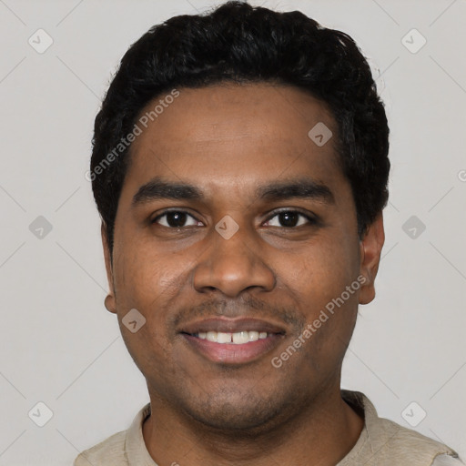 Joyful black young-adult male with short  black hair and brown eyes