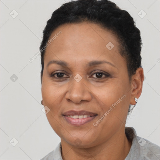 Joyful latino adult female with short  brown hair and brown eyes