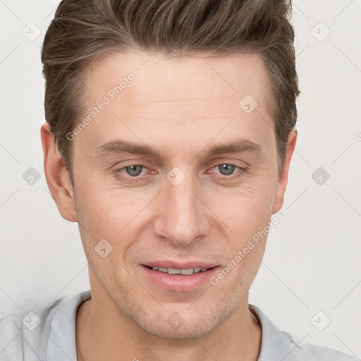 Joyful white adult male with short  brown hair and grey eyes