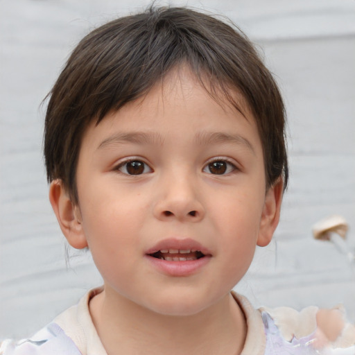 Joyful white child female with short  brown hair and brown eyes