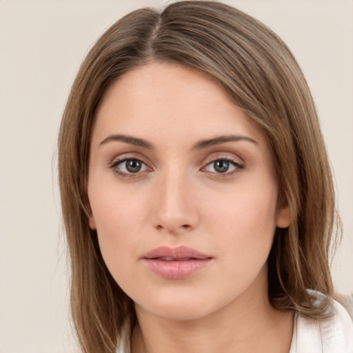 Neutral white young-adult female with long  brown hair and brown eyes