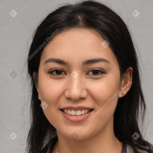 Joyful asian young-adult female with long  brown hair and brown eyes