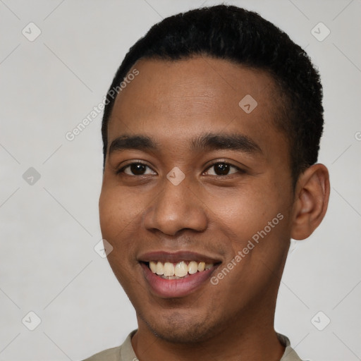 Joyful black young-adult male with short  black hair and brown eyes