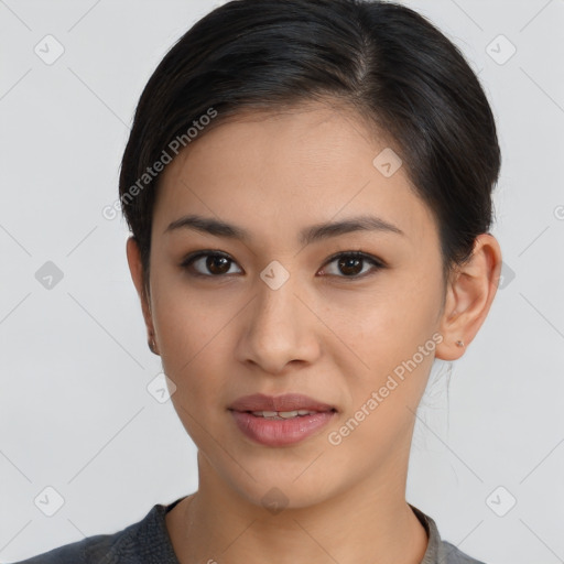 Joyful latino young-adult female with short  brown hair and brown eyes