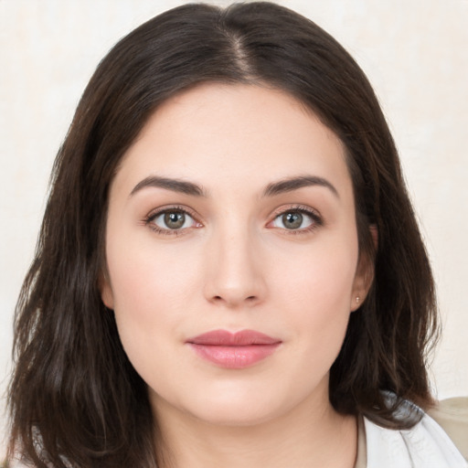 Neutral white young-adult female with long  brown hair and brown eyes