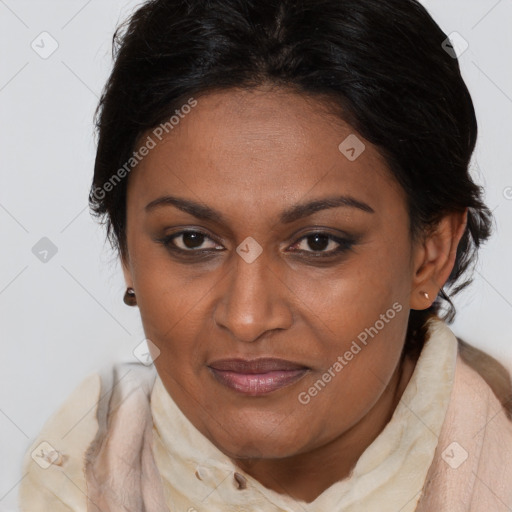 Joyful black adult female with medium  brown hair and brown eyes