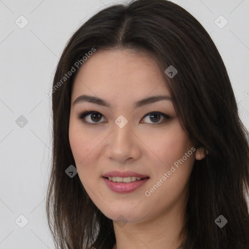 Joyful asian young-adult female with long  brown hair and brown eyes