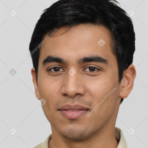 Joyful latino young-adult male with short  black hair and brown eyes