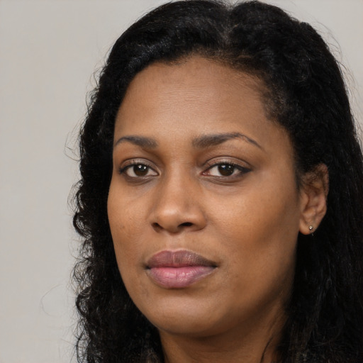 Neutral black young-adult female with long  black hair and brown eyes