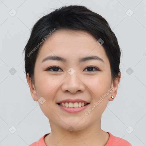 Joyful asian young-adult female with short  black hair and brown eyes