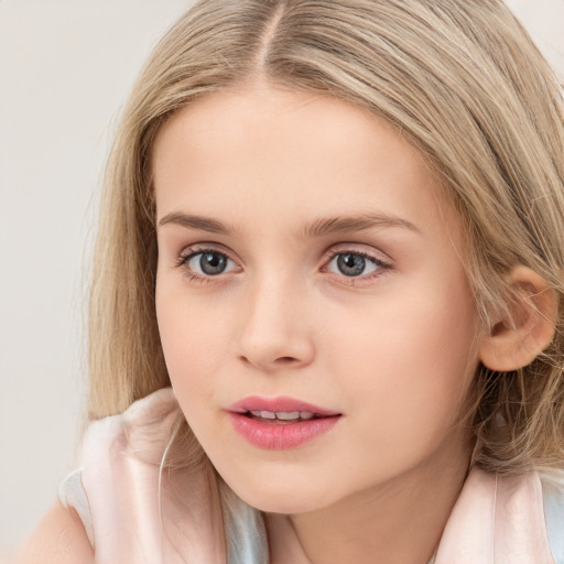 Joyful white child female with long  brown hair and blue eyes