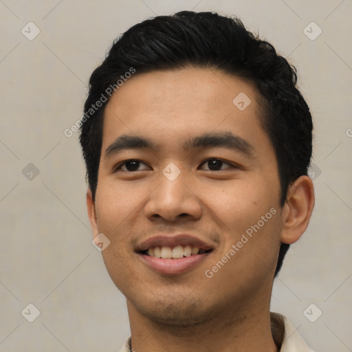 Joyful asian young-adult male with short  black hair and brown eyes