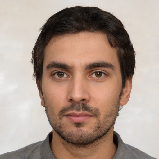 Neutral white young-adult male with short  black hair and brown eyes