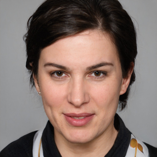 Joyful white adult female with medium  brown hair and brown eyes