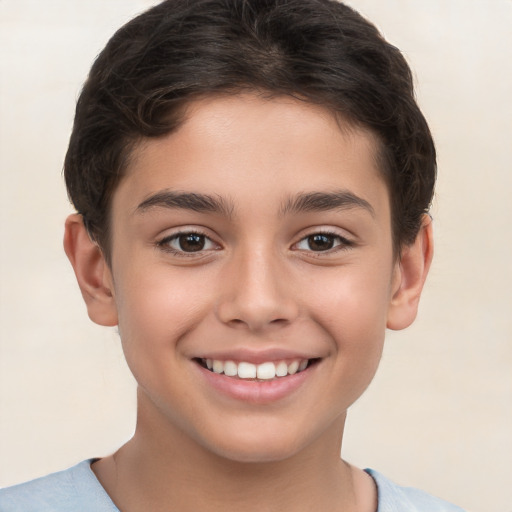 Joyful white child male with short  brown hair and brown eyes