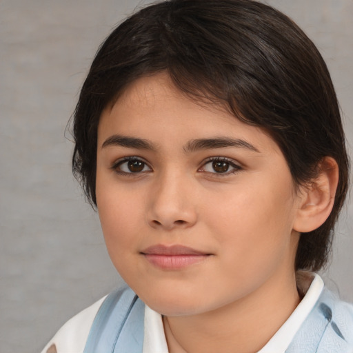 Joyful white child female with medium  brown hair and brown eyes