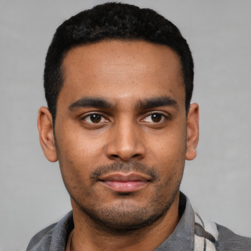 Neutral latino young-adult male with short  black hair and brown eyes