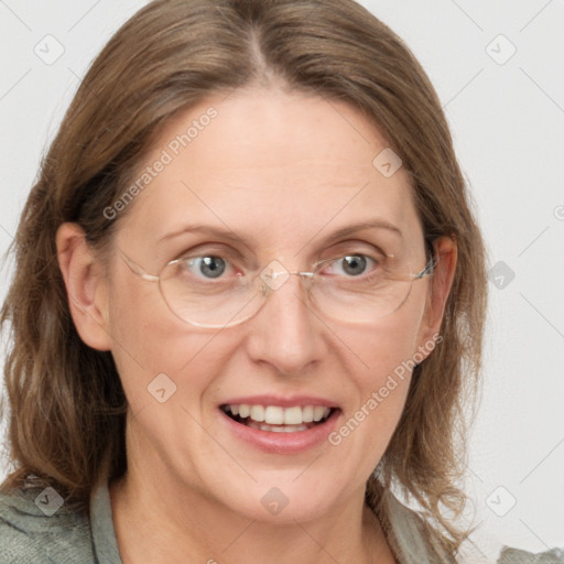 Joyful white adult female with medium  brown hair and blue eyes