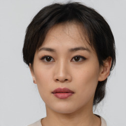 Neutral asian young-adult female with medium  brown hair and brown eyes