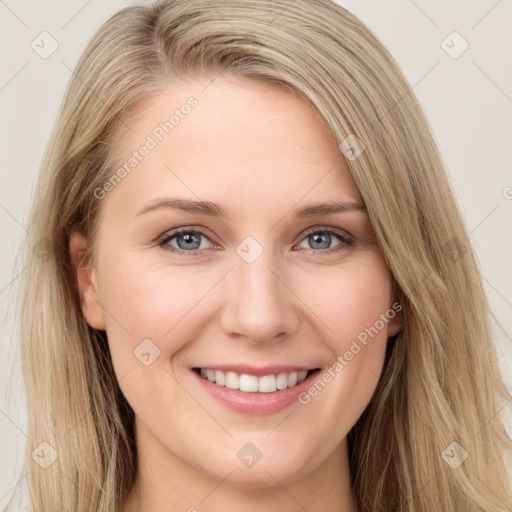 Joyful white young-adult female with long  brown hair and blue eyes