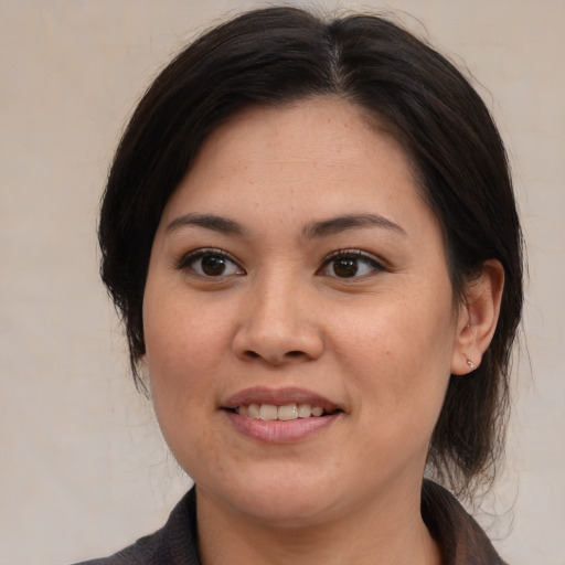 Joyful white young-adult female with medium  brown hair and brown eyes