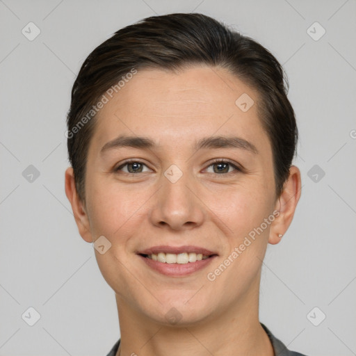 Joyful white young-adult female with short  brown hair and brown eyes