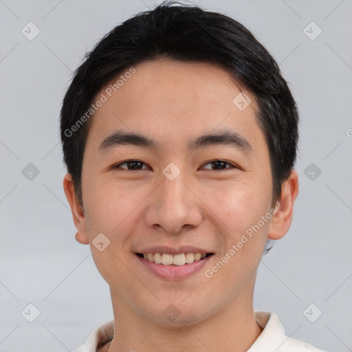 Joyful asian young-adult male with short  black hair and brown eyes