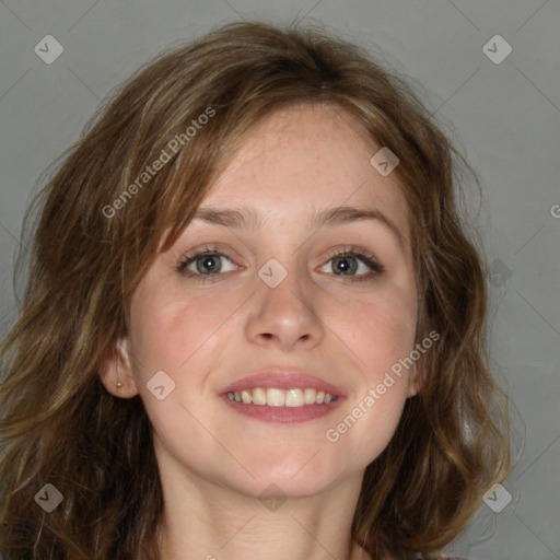 Joyful white young-adult female with long  brown hair and blue eyes