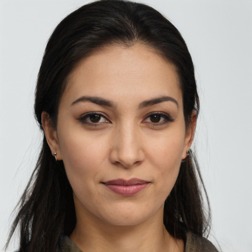 Joyful latino young-adult female with long  brown hair and brown eyes