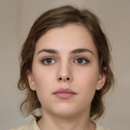 Neutral white young-adult female with medium  brown hair and brown eyes