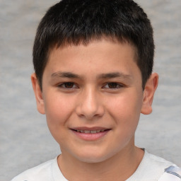 Joyful white child male with short  brown hair and brown eyes